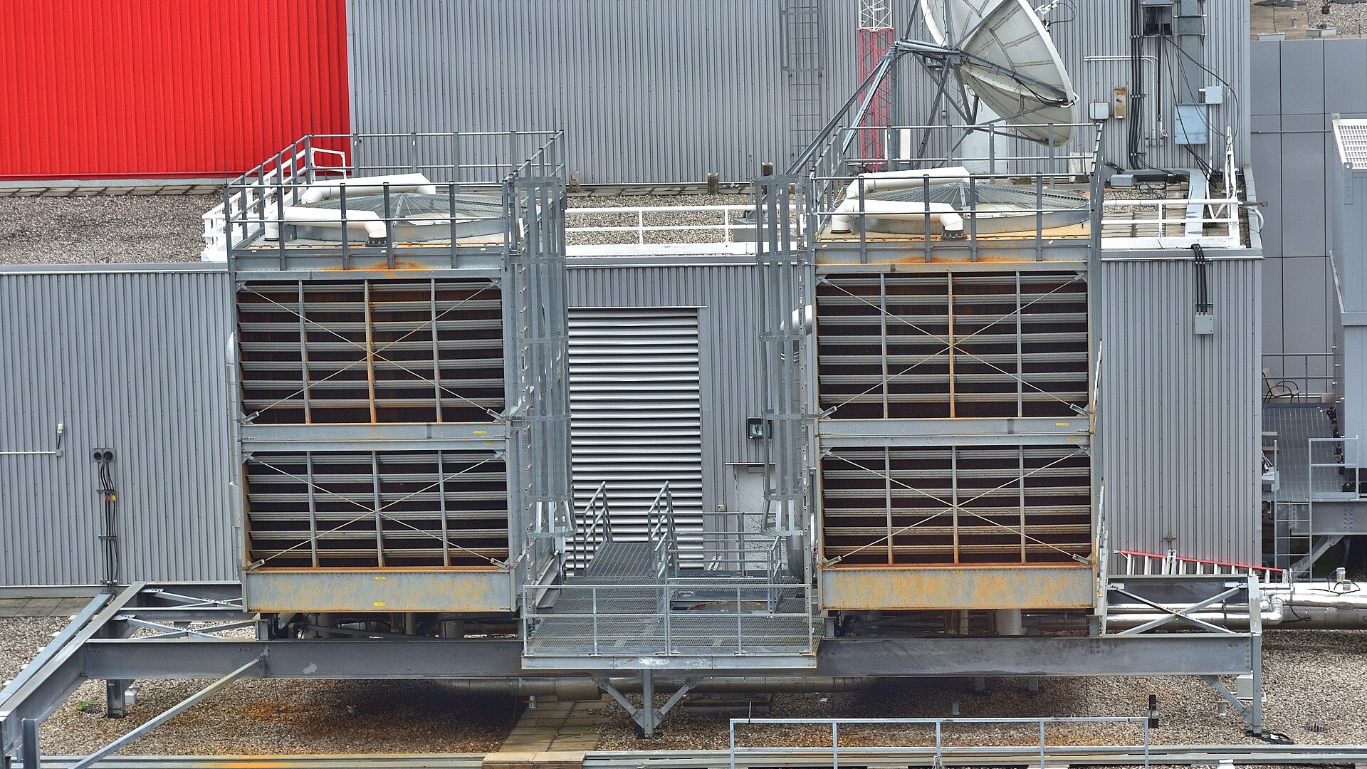 Two-cell evaporative cooling tower installation on an industrial rooftop