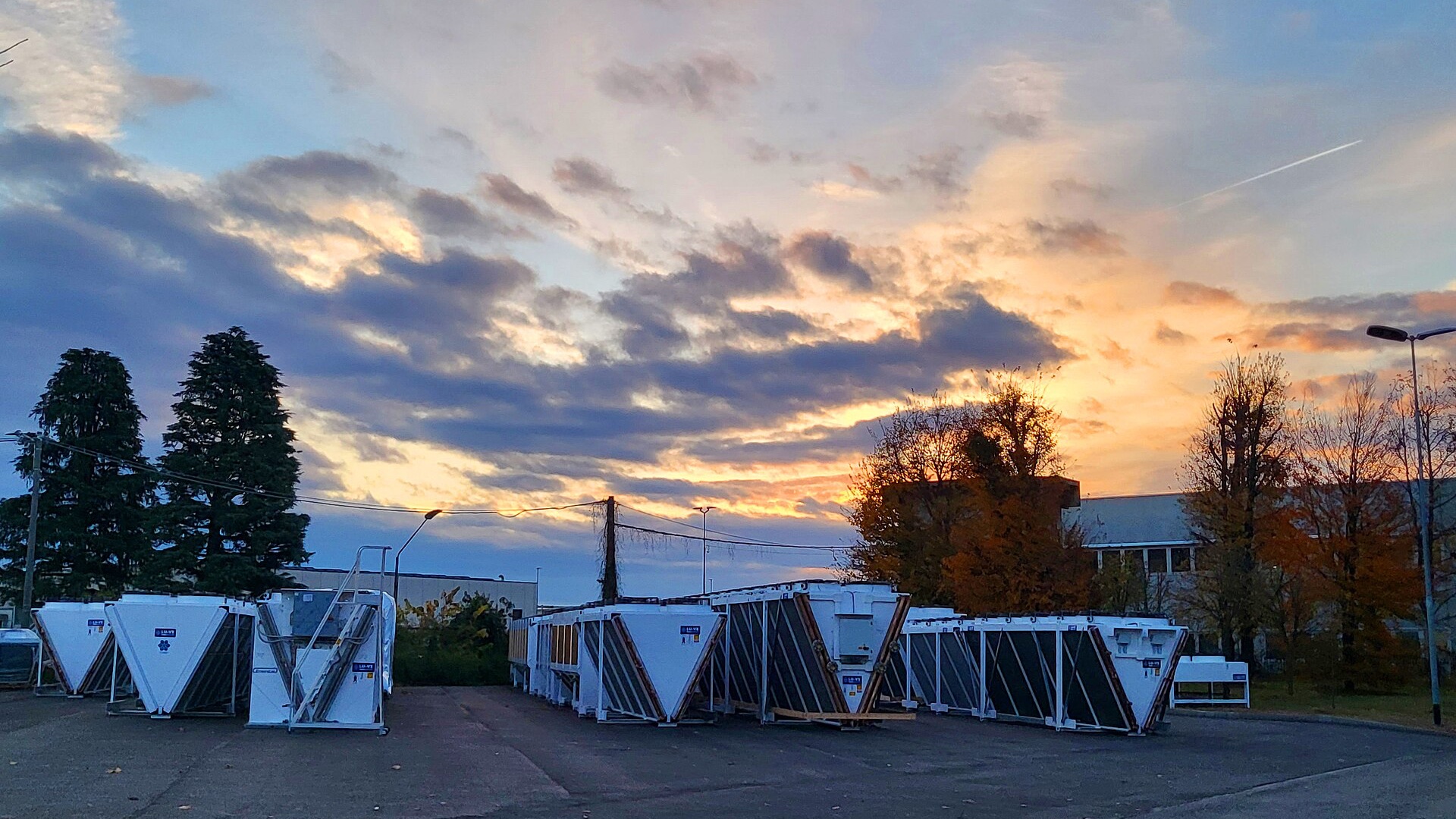 Multiple V-bank industrial dry coolers arranged outdoors